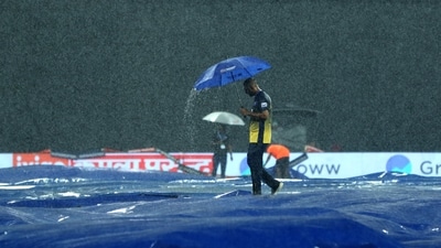 A ground staff walks above the covers after rain stops play during the Super Four match between India and Pakistan in the Asia Cup (ANI) A ground staff walks above the covers after rain stops play during the Super Four match between India and Pakistan in the Asia Cup (ANI)