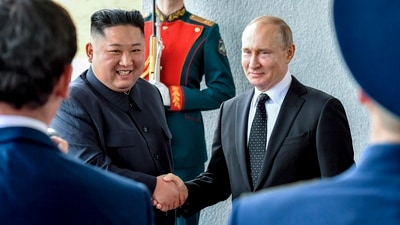 Russian President Vladimir Putin, center right, and North Korea's leader Kim Jong Un shake hands during their meeting in Vladivostok, Russia. (File/AP)