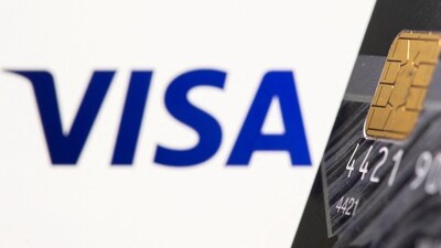 Credit card is seen in front of displayed Visa logo (REUTERS)