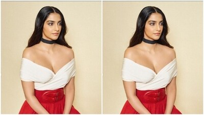 Sonam looked like a diva in a white off-shoulder top with wrap sleeves and a plunging neckline. She teamed it with a bright red long skirt featuring pleats and a matching leather belt on the waist. (Instagram/@sonamkapoor) Sonam looked like a diva in a white off-shoulder top with wrap sleeves and a plunging neckline. She teamed it with a bright red long skirt featuring pleats and a matching leather belt on the waist. (Instagram/@sonamkapoor)