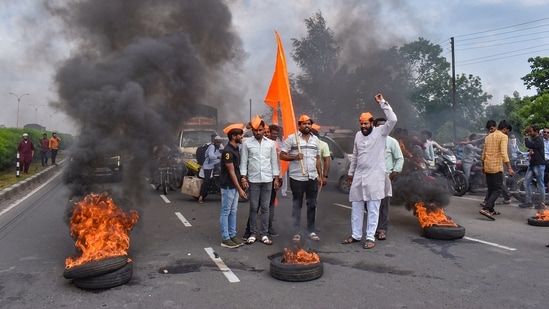 Maratha Kranti Morcha members burn tires on Pune-Solapur Highway while staging 'Rasta Roko' protest (PTI)