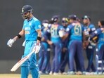 Virat Kohli walks to the pavilion after being dismissed during the Asia Cup cricket match between Sri Lanka and India