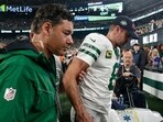 New York Jets quarterback Aaron Rodgers (8) is helped off the field during the first quarter of an NFL football game against the Buffalo Bills, Monday, Sept. 11, 2023, in East Rutherford, N.J. (AP Photo/Adam Hunger) New York Jets quarterback Aaron Rodgers (8) is helped off the field during the first quarter of an NFL football game against the Buffalo Bills, Monday, Sept. 11, 2023, in East Rutherford, N.J. (AP Photo/Adam Hunger)