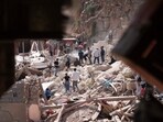 Morocco Earthquake: People dig through the rubble as they search for people who were killed by the earthquake, in the town of Imi N'tala, outside Marrakech, Morocco.