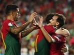 Portugal's Ricardo Horta celebrates scoring their sixth goal with Diogo Jota and Joao Cancelo