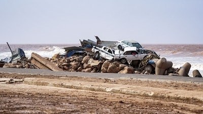 This handout picture provided by the office of Libya's Benghazi-based interim Prime Minister on September 11, shows a view of vehicles piled up along the side of a coastal road in the eastern city of Derna, in the wake of the Mediterranean storm "Daniel". (The Press Office of Libyan Prime Minister / AFP) This handout picture provided by the office of Libya's Benghazi-based interim Prime Minister on September 11, shows a view of vehicles piled up along the side of a coastal road in the eastern city of Derna, in the wake of the Mediterranean storm "Daniel". (The Press Office of Libyan Prime Minister / AFP)