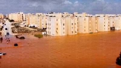 Streets are seen flooded after storm Daniel in Marj, Libya. This grab is from a video by residents of the city. Entire residential areas were erased along a river that runs down from the mountains through the city center. Multistoried apartment buildings that once stood well back from the river partially collapsed into the mud. (AP) Streets are seen flooded after storm Daniel in Marj, Libya. This grab is from a video by residents of the city. Entire residential areas were erased along a river that runs down from the mountains through the city center. Multistoried apartment buildings that once stood well back from the river partially collapsed into the mud. (AP)