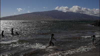 A family cools off in the ocean in Kihei, Hawaii (AP) A family cools off in the ocean in Kihei, Hawaii (AP)