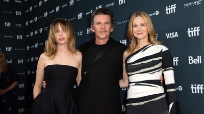 Actor Maya Hawke (left), actor and director Ethan Hawke (centre) and actor Laura Linney arrive for the premiere of Wildcat during the Toronto International Film Festival (TIFF) on Monday. (AFP) Actor Maya Hawke (left), actor and director Ethan Hawke (centre) and actor Laura Linney arrive for the premiere of Wildcat during the Toronto International Film Festival (TIFF) on Monday. (AFP)