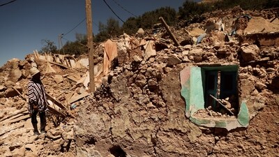 Mohamed Ouchen, 66, a survivor, who helped to pull his sister and her husband with their children from rubble, looks at his destroyed house, in the aftermath of a deadly earthquake, in Morocco (REUTERS)
