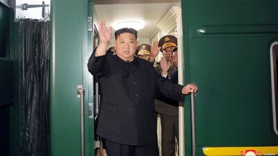 North Korean leader Kim Jong Un waves from a private train as he departs Pyongyang, North Korea, to visit Russia. (Reuters)