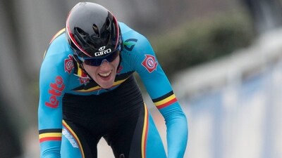 Belgium's Nathan van Hooydonck strains as he crosses the finish line during the junior men's time trial event of the Road World Championship Cycling (AP)