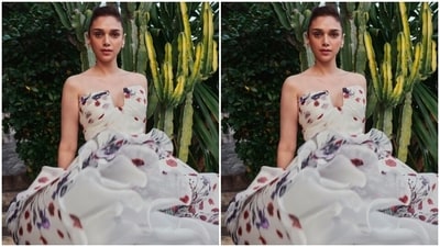 Aditi looked every bit gorgeous in the white off-shoulder silk gown with floral patterns cascading to a long flowy skirt. The gown also featured a bow detail at the back. (Instagram/@aditiraohydari) Aditi looked every bit gorgeous in the white off-shoulder silk gown with floral patterns cascading to a long flowy skirt. The gown also featured a bow detail at the back. (Instagram/@aditiraohydari)