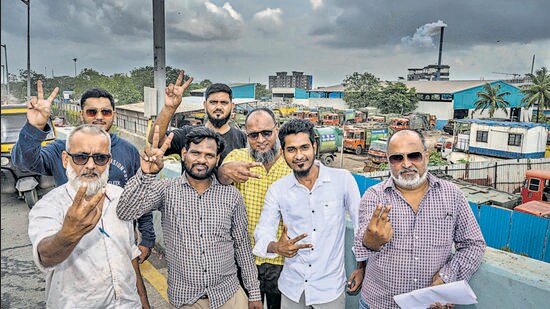 Petitioner Faiyaz Alam Shaikh (second from right) celebrates the HC verdict with other residents of Govandi on Tuesday. (Satish Bate/ HT Photo)
