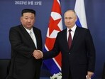 Russian president Vladimir Putin, right, and North Korea's leader Kim Jong Un shake hands during their meeting.