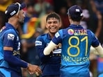 Sri Lanka's Dunith Wellalage (C) celebrates with teammates after taking the wicket of India's KL Rahul