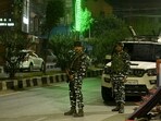 Indian security personnel stand guard outside a police headquarter in Srinagar.