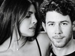 Priyanka Chopra and Nick Jonas pose inside the Dodger Stadium.