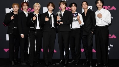 K-pop boy band Stray Kids poses for the paparazzi with their MTV VMAs award for Best K-pop for S-Class. The members chose monochromatic looks for the occasion. (Evan Agostini/Invision/AP) K-pop boy band Stray Kids poses for the paparazzi with their MTV VMAs award for Best K-pop for S-Class. The members chose monochromatic looks for the occasion. (Evan Agostini/Invision/AP)