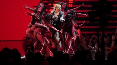 Doja Cat performs during the MTV Video Music Awards on Tuesday. Doja Cat is no stranger to the MTV VMAs stage, having performed for the first time in 2020, then again in 2021, when she even hosted the awards show. This time around, the singer-rapper returns to the VMAs as a nominee, former winner and performer. (AP) 