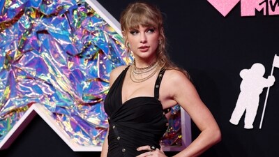 As the top nominated artist at the MTV VMAs, Taylor Swift dressed for a big night. The singer arrived on the red carpet wearing a black slit dress. Taylor had a monumental, history-making night at the 2023 VMAs, tying for most wins in one night with an impressive nine trophies — and second-most overall wins. (REUTERS) 