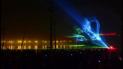 An image of Lord Ram floats atop the tent city of Magh Mela as part of a water-laser show on Sangam banks in Prayagraj (HT File photo)
