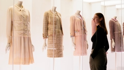 A curator poses next to creations which are displayed as part of the "Gabrielle Chanel. Fashion Manifesto" exhibition at the Victoria and Albert museum. (AP) A curator poses next to creations which are displayed as part of the "Gabrielle Chanel. Fashion Manifesto" exhibition at the Victoria and Albert museum. (AP)