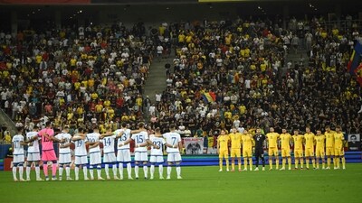 Kosovo's team (L) and Romania's team (R) observe a moment of silence held for the victims of the Morocco's earthquake and Lybia's floods prior to the EURO 2024 qualifier match (AFP) Kosovo's team (L) and Romania's team (R) observe a moment of silence held for the victims of the Morocco's earthquake and Lybia's floods prior to the EURO 2024 qualifier match (AFP)