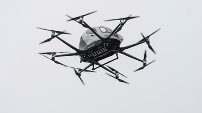 An automated drone taxi hovers in the air during an unveiling of the driverless technology outside Hadassah Medical Center in Jerusalem (AP) An automated drone taxi hovers in the air during an unveiling of the driverless technology outside Hadassah Medical Center in Jerusalem (AP)