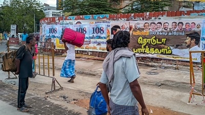 Coimbatore: People watch posters put up by the DMK in connection with ongoing Sanatana Dharm row, in Coimbatore, Wednesday, Sept. 6, 2023. (PTI Photo) (PTI09_06_2023_000026A) (PTI) Coimbatore: People watch posters put up by the DMK in connection with ongoing Sanatana Dharm row, in Coimbatore, Wednesday, Sept. 6, 2023. (PTI Photo) (PTI09_06_2023_000026A) (PTI)