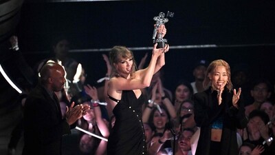 Taylor Swift once again dominated the MTV Video Music Awards, winning for every televised category in which she was nominated. Here she accepts the Video of the Year award onstage during the VMAs. (AFP)