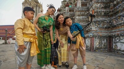 Chinese family tourists rent traditional Thai costumes and take selfies at Wat Arun, or the "Temple of Dawn," in Bangkok, Thailand. (AP) Chinese family tourists rent traditional Thai costumes and take selfies at Wat Arun, or the "Temple of Dawn," in Bangkok, Thailand. (AP)