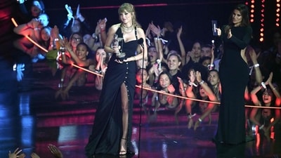 US singer-songwriter Taylor Swift accepts the award for the Song of the Year category for Anti-Hero during the MTV Video Music Awards at the Prudential Center. The star channelled her boss-base Reputation era vibes in a black slit dress, bold eye makeup, and striking jewellery pieces. (AFP) US singer-songwriter Taylor Swift accepts the award for the Song of the Year category for Anti-Hero during the MTV Video Music Awards at the Prudential Center. The star channelled her boss-base Reputation era vibes in a black slit dress, bold eye makeup, and striking jewellery pieces. (AFP)