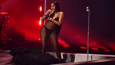 Nicki Minaj performs onstage during the MTV Video Music Awards in a black see-through embellished dress worn over matching black lingerie. (AFP) Nicki Minaj performs onstage during the MTV Video Music Awards in a black see-through embellished dress worn over matching black lingerie. (AFP)