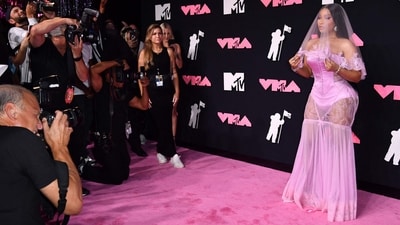 US rapper and singer Nicki Minaj arrived for the MTV Video Music Awards in a pink bridal look by Dolce & Gabbana. The star wore pastel pink lingerie, a bubblegum pink veil, and a see-through lace mermaid skirt for the event. She styled the Barbie-inspired funky look with long embellished nails, bold eye makeup, nude lips, diamond earrings, rings, and high heels. (AFP) US rapper and singer Nicki Minaj arrived for the MTV Video Music Awards in a pink bridal look by Dolce & Gabbana. The star wore pastel pink lingerie, a bubblegum pink veil, and a see-through lace mermaid skirt for the event. She styled the Barbie-inspired funky look with long embellished nails, bold eye makeup, nude lips, diamond earrings, rings, and high heels. (AFP)