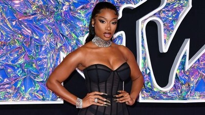 US rapper Megan Thee Stallion looked absolutely stunning in a form-fitting black dress, a thick diamond necklace, matching bracelet and slicked-back hair during the MTV VMAs. A dark lip and sultry eye makeup added a touch of glamour to her strapless see-through ensemble. (AFP) US rapper Megan Thee Stallion looked absolutely stunning in a form-fitting black dress, a thick diamond necklace, matching bracelet and slicked-back hair during the MTV VMAs. A dark lip and sultry eye makeup added a touch of glamour to her strapless see-through ensemble. (AFP)