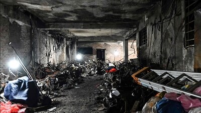 Vietnam Fire: Burned motorbikes and the damage on the ground floor of a 10-storey building after a major fire at an apartment block in Hanoi. (AFP) Vietnam Fire: Burned motorbikes and the damage on the ground floor of a 10-storey building after a major fire at an apartment block in Hanoi. (AFP)
