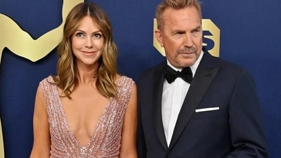 Christine Baumgartner and Kevin Costner (Shutterstock) Christine Baumgartner and Kevin Costner (Shutterstock)