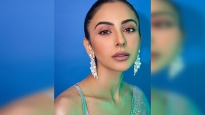 To complete her stunning ensemble, Rakul Preet opted for a sleek high bun, allowing the saree and her matching pearl dangler earrings to take center stage. (Instagram/@rakulpreet) To complete her stunning ensemble, Rakul Preet opted for a sleek high bun, allowing the saree and her matching pearl dangler earrings to take center stage. (Instagram/@rakulpreet)