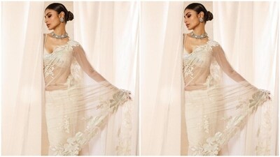 Mouni teamed her saree with a matching white sleeveless blouse with a plunging neckline. "My front row cliché," Mouni captioned her pictures. (Instagram/@imouniroy) Mouni teamed her saree with a matching white sleeveless blouse with a plunging neckline. "My front row cliché," Mouni captioned her pictures. (Instagram/@imouniroy)
