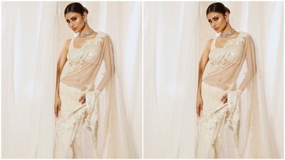In statement silver ear studs and a neck choker from the house of Anmol Jewellers, Mouni further accessorised her look for the day. (Instagram/@imouniroy) In statement silver ear studs and a neck choker from the house of Anmol Jewellers, Mouni further accessorised her look for the day. (Instagram/@imouniroy)