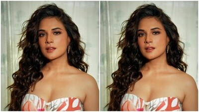Richa looked like a dream in a multicoloured jumpsuit featuring off-shoulder and corset patterns. The silk jumpsuit featured quirky patterns in shades of multiple colours and cascaded to wide legs. (Instagram/@therichachadha) Richa looked like a dream in a multicoloured jumpsuit featuring off-shoulder and corset patterns. The silk jumpsuit featured quirky patterns in shades of multiple colours and cascaded to wide legs. (Instagram/@therichachadha)