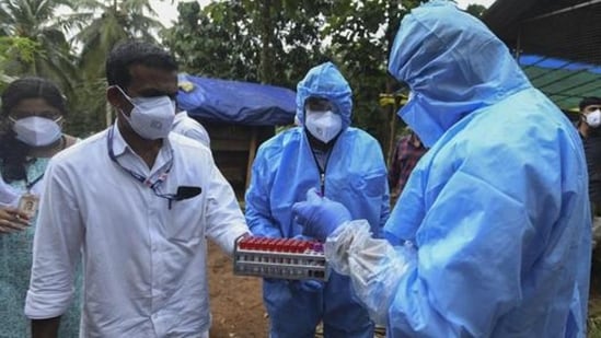 Health workers collect blood samples in the neighborhood for testing after a 12-year-old boy died of the Nipah virus in Kozhikode. (AP)