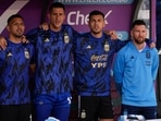Argentina's Lionel Messi, right, sings the national anthem with teammates prior a qualifying soccer match for the FIFA World Cup 2026.