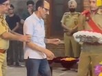 DSP Humayun Bhat's father Ghulam Hasaan Bhat, an ex-cop, laying a wreath on the mortal remains of his son. 