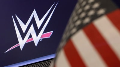 The logo for WWE appears above a trading post on the floor of the New York Stock Exchange (AP) The logo for WWE appears above a trading post on the floor of the New York Stock Exchange (AP)