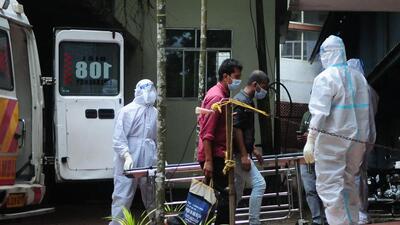 Health workers wearing protective gear shift people who have been in contact with a person infected with the Nipah virus to an isolation centre at a goverment hospital in Kozikode. (AFP) Health workers wearing protective gear shift people who have been in contact with a person infected with the Nipah virus to an isolation centre at a goverment hospital in Kozikode. (AFP)