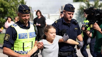 Climate activist Greta Thunberg is carried away by police officers after she took part in a new climate action in Oljehamnen in Malmo, Sweden. (AFP) Climate activist Greta Thunberg is carried away by police officers after she took part in a new climate action in Oljehamnen in Malmo, Sweden. (AFP)