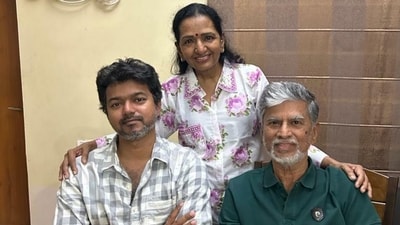 Vijay posed for a photo with his parents. Vijay posed for a photo with his parents.