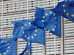 European Union flags flutter outside the EU Commission headquarters in Brussels, Belgium.